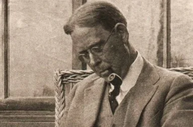 Close-up historical photo of theosophist John Garrigues with his pipe.