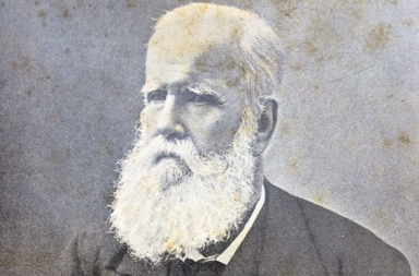 Retrato histórico do imperador idoso com barba branca longa, ilustrando a filosofia de Dom Pedro II.