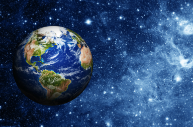 Planeta Terra visto do espaço com fundo de estrelas e galáxia azul para o artigo sobre o perdão que transcende o conflito.