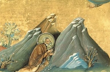 Ícone bizantino de santo eremita em oração entre montanhas rochosas para o artigo que analisa o verdadeiro significado de demonios.