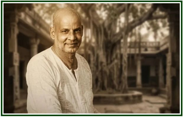 Retrato em tons de cinza de Swami Sivananda, cuja expressão serena reflete o ensinamento sobre o desapego.